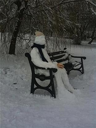 Snowman spotted chilling out on a bench in St Albans
