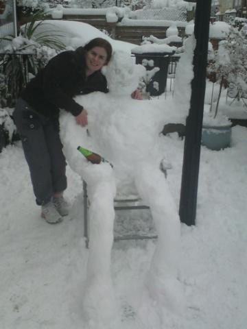 Cold one: snowman warms up with a chilled beer
