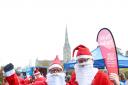 Santa Bromley, right, on the run. Picture by Spencer Mulholland