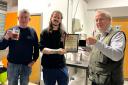 Aaron Lewis (centre) of Dark Revolution receives the Beer of the Festival award from CAMRA’s local festivals co-ordinator Andrew Hesketh (right) and CAMRA branch chairman Chris White (left).