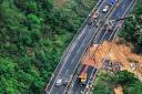 An aerial photo shows rescuers work at the site of a collapsed road section of the Meizhou-Dabu Expressway in Meizhou, south China’s Guangdong Province (Xinhua News Agency via AP)