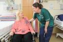 Senior nursing assistant Lindsey Boase with a patient on the spinal centre