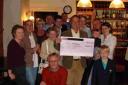 Regulars from the South Western public house in Tisbury with their monster cheque.