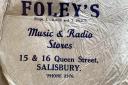 A logo for Foley's Music and Radio Stores.