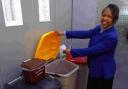 Administrative officer Lorraine Stacey uses the plastic recycling bin. DB7078P2