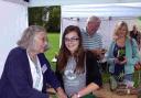 Marianne Clare instructs Charlotte Greatorex in the art of potting at Salisbury Allotments Association RHS Dig Together Day last September. DB8357P4