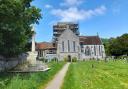 The Abbey Church of St Mary and St Melor in Amesbury with scaffolding on the tower for repairs.