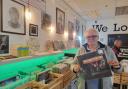 Paul Smith with a copy of Elton John’s album ‘Don’t Shoot Me.’ The longtime Elton John superfan is selling his Cross Keys record shop, Vinyl Collectors and Sellers, after eight years to move on to further projects and spend more time with family.