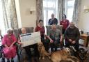 Braemar Lodge residents Catherine Brighty and, holding cheque, Douglas Parish; Katie Ransby and Queenie; Justin Wright with Ned; and Richard Burt with Dilly.