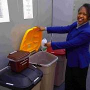 Administrative officer Lorraine Stacey uses the plastic recycling bin. DB7078P2