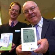 Community librarian Philip Tomes and Wiltshire Council cabinet member for economic development Cllr John Brady with one of the new energy monitors available on loan from Salisbury Library. DB7416P2