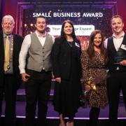Andy Rhind-Tutt, left, presenting an award at a 2019 Business Awards ceremony