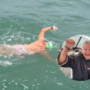 Brian Elliott swimming in the English Channel and celebrating the successful relay.