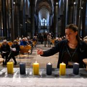Candles in the colours of the Ukrainian flag were place on the Trinity Chapel Altar during Prayers for Ukraine at Salisbury Cathedral