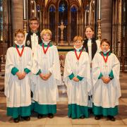 The Dean of Salisbury and Canon Precentor with the four newly promoted choristers.