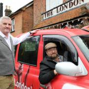 Phil Hoyle, left, landlord of The London Tavern, and Philip Bristow, Ringwood’s first London-style cabbie.