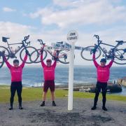 The Green family cycling team beat rain, wind, mountains and snow to reach John O'Groats after nine days.