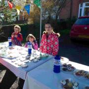 Girls organise cake sale for John McNeill