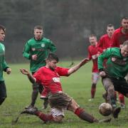 Redlynch & DI Utd battle in the mud..