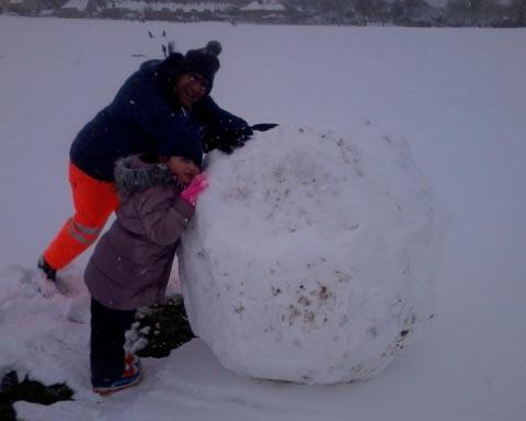 It's hard work rolling a snowman. Picture by Jeanette Ford.