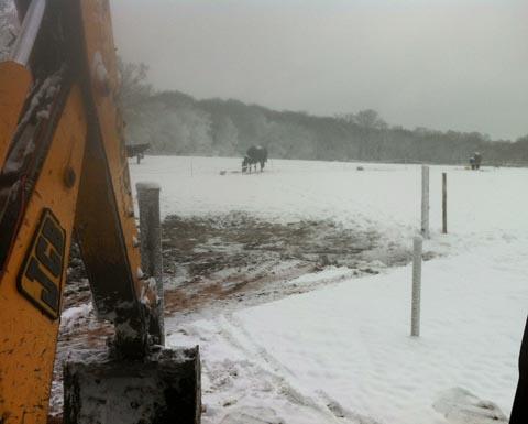 Daniel Reed has no time to play in the snow, hard at work in his digger.