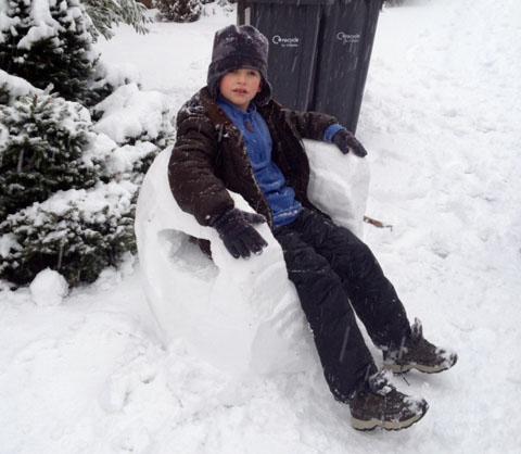 Nathalie Grosse sent us a picture of her son Tristan, seven, overseeing the snowman-building from his snow throne.
