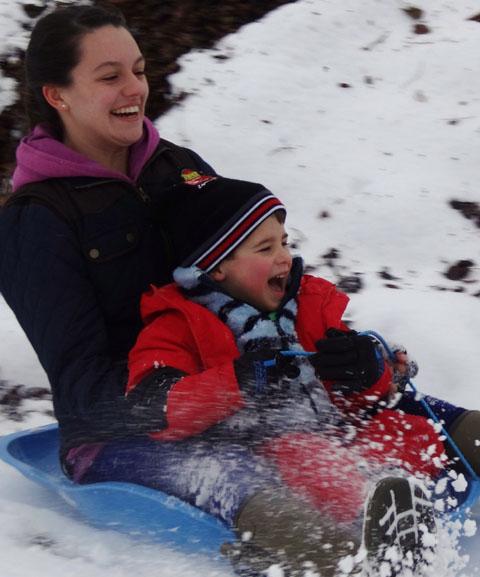 Eleanor Lickard and Ethan Bawden enjoying some sledging. Picture by Gemma Cuss.
