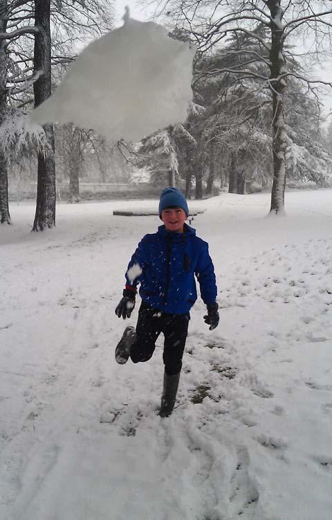Oliver Gentleman fires a snowball at cameraman Leyanne Hind in Victoria Park.