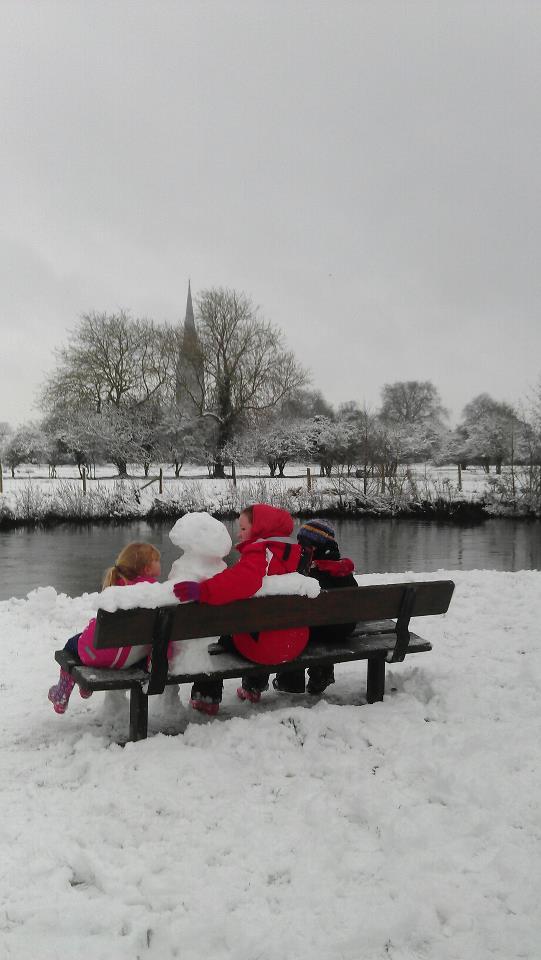 Kate Walklett sent this picture of people enjoying the view with a snowman friend.