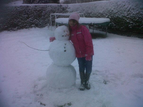 Ellie with her snowman. Taken by Mandy Mearns. 