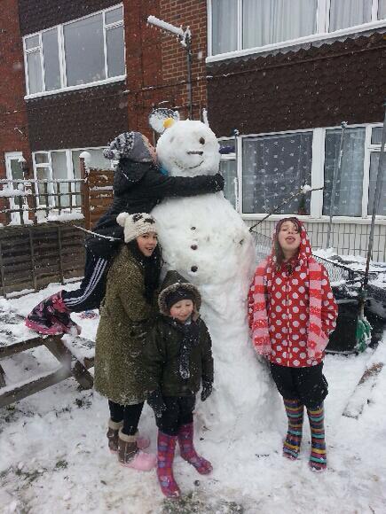 Rosie Lewis sent in this picture of her children with their giant snowman.