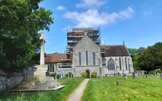 The Abbey Church of St Mary and St Melor in Amesbury with scaffolding on the tower for repairs.