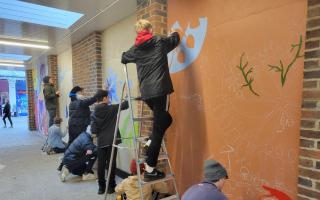 Bishop Wordsworth's students arrived at Pepys Walk on Tuesday, November 21 to help paint a series of murals along the pedestrian route.