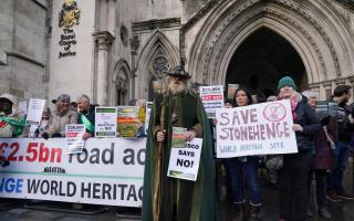 Campaigners with Stonehenge Alliance outside the High Court in central London on Tuesday, December 12, 2023.