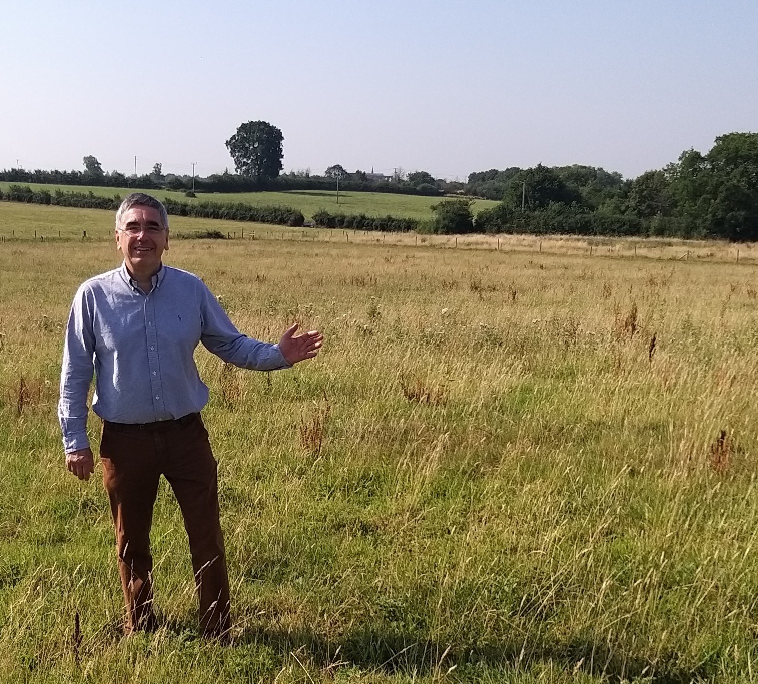 Mayor of Malmesbury, Campbell Ritchie, highlighting the view towards Malmesbury Abbey at the Filands site that was given planning permission in May in breach of the Malmesbury Neighbourhood Plan 