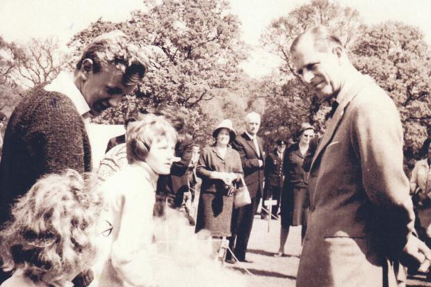 In May 1965 the Duke of Edinburgh met members of East Howe Youth Club at Brockenhurst camp site when they were doing their bronze award for the Duke of Edinburgh Awards. Boy on the left is John White. Picture taken by Ray Cozins