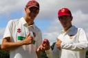 Josh Croom and Tom Lewis pictured with the match ball after each taking five wickets for South Wilts (Picture: Roy Honeybone)