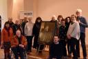Some past and present Salisbury Journal staff with the painting of its co founder  Benjamin Collins at Salisbury Museum.