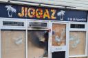 Jiggaz Grill was set on fire after vandals smashed the windows two days prior.