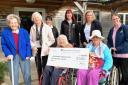 Gemma Hicks and Residents presenting their cheque to Sara-Jane Hancock
