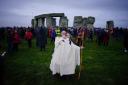 People take part in the winter solstice celebrations during sunrise at the Stonehenge