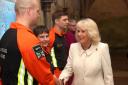Queen Camilla is greeted by air ambulance charity reps