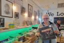 Paul Smith with a copy of Elton John’s album ‘Don’t Shoot Me.’ The longtime Elton John superfan is selling his Cross Keys record shop, Vinyl Collectors and Sellers, after eight years to move on to further projects and spend more time with family.