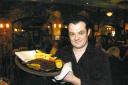 Spotted Cow manager Tony Kear-Smith poses for a food review photo in April 2006.