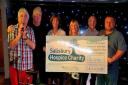 Music4fun raises £2,000. From left, Yan Webber, Andy Marks, Celia Scott (of Salisbury Hospice), Terri Johnson, George Mathers and Steve Edwards