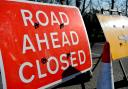 Road still closed after milk lorry crash
