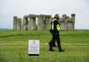 Security patrol the area around Stonehenge as people gather ahead of the Solstice earlier this year.  Photo: PA.