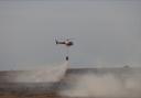 Helicopter deployed to tackle the Salisbury Plain wildfire. Credit: MOD 2022