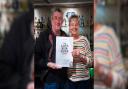 Local CAMRA chairman Chris White presents Lorna Janse van Vuuren, landlady of The Bridge Inn, Upper Woodford,  with her Good Beer Guide certificate.