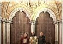 The new single by alternative pop band Love Is Enough. Pictured outside Salisbury Cathedral: From Left: Thor Porter, Cameron Walker and Ben Whatsley.  Front – Cameron’s rainbow son Atticus Walker